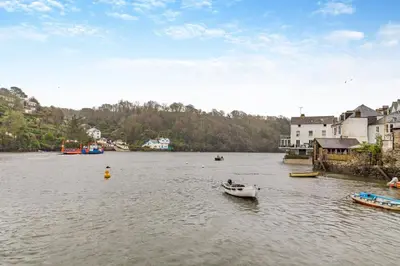 a small boat in the water in a river at 2 Bed in Fowey oc-s25324 in Fowey