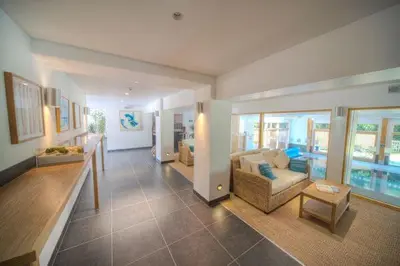 a living room with a couch and a table at House 27 in Looe