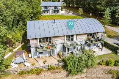 an aerial view of a house with a metal roof at House 23 in Looe