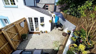an overhead view of a backyard with a wooden fence at North Cornwall 2-Bed Detached Period Cottage With Parking in Camelford