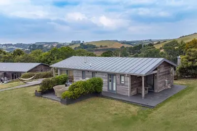 a small house in the middle of a yard at House 37 in Looe