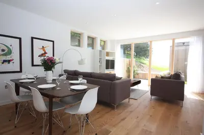 a living room with a table and a couch at House 47 in Talland