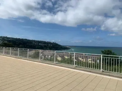 a balcony with a view of the ocean at Stunning 2 bedroom modern apartment! Amazing views! in Carbis Bay