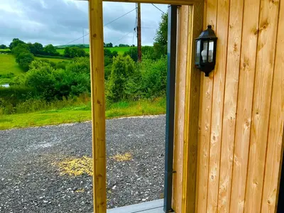 a door to a building with a view of a road at The Jeep House in the Area of Outstanding Natural Beauty in Liskeard