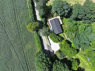 an overhead view of a farm field with a road at Owl Lodge in Liskeard