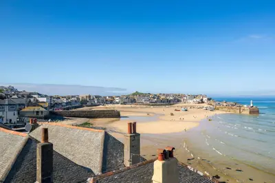 a view of a beach with houses and the ocean at Blue Mist Studio in St Ives