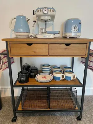 a table with cups and appliances on top of it at Sea view Studio by Fistral Beach in Newquay