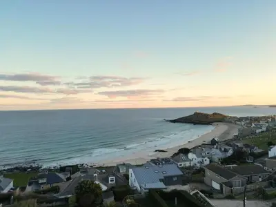 a view of a beach with houses and the ocean at 4 Bed in St. Ives oc-c28788 in St Ives