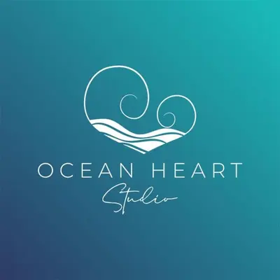 a wave in a heart logo at Ocean Heart Studio- Luxury, Rural Retreat in Wendron