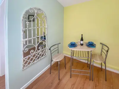 a dining room with a table and chairs at Gwennel Nook in St. Agnes