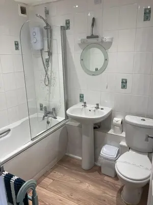 a bathroom with a sink and a toilet and a shower at 'The Dunes', Porthtowan in Porthtowan