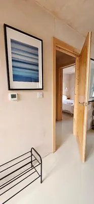 a room with a flat screen tv on the wall at Shorebreak Apartment 2 in Newquay