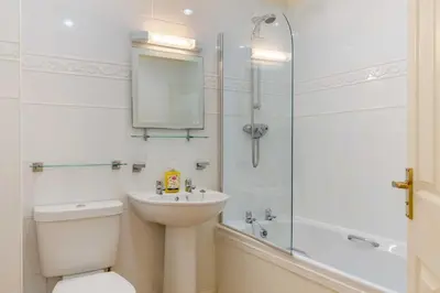 a bathroom with a toilet and a sink and a shower at 2 Bed in St. Issey oc-a32428 in Saint Issey