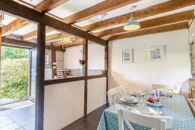 a dining room with a table and chairs at 2 Bed in Fowey oc-d32427 in Fowey