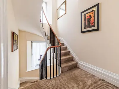 a staircase in a home with a stair case at Holiday Home Tregony House by Interhome in Mevagissey