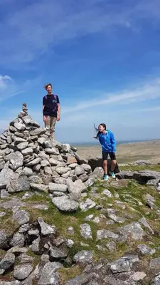 two people standing on top of a pile of rocks at Cleave Cottage in Crackington Haven
