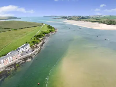 an aerial view of a river with a beach at 1 Bed in Padstow oc-t32456 in Padstow