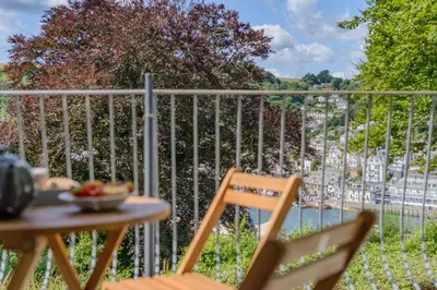 a table and chairs on a balcony with a view at 2 Bed in Looe oc-g32529 in Looe