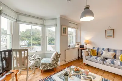 a living room with a couch and a table at 2 Bed in Fowey oc-p00638 in Fowey