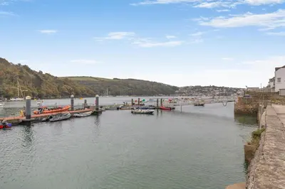 a group of boats docked at a dock in the water at 2 Bed in Fowey oc-p00638 in Fowey