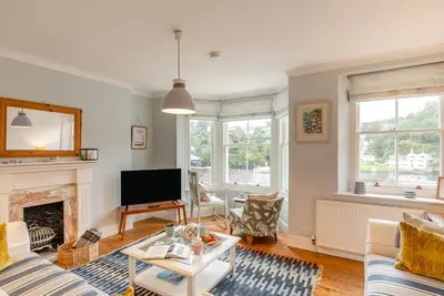 a living room with a fireplace and a tv at 2 Bed in Fowey oc-p00638 in Fowey