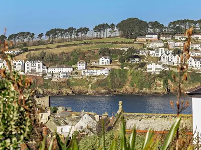 a view of a town with a river and houses at 2 Bed in Fowey oc-91015 in Polruan