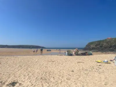 a group of people on a sandy beach at 159 Atlantic Bays St Merryn in St Merryn