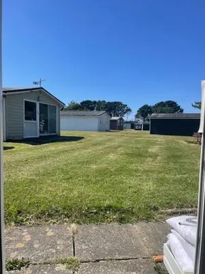 a view of a yard from the window of a house at 159 Atlantic Bays St Merryn in St Merryn
