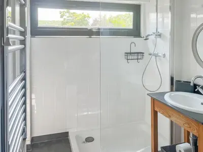 a bathroom with a shower and a sink at The Saltings in Egloshayle