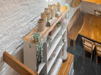 a table with pots and plants on top of it at The Saltings in Egloshayle