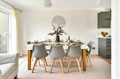 a dining room with a table and chairs at Cornish house, close to beaches - Ashfield Villas in Falmouth