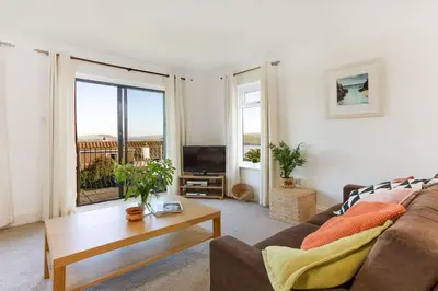 a living room with a couch and a coffee table at Beau Vista GF in Padstow