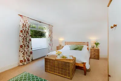 a bedroom with a bed and a window at Beau Vista GF in Padstow