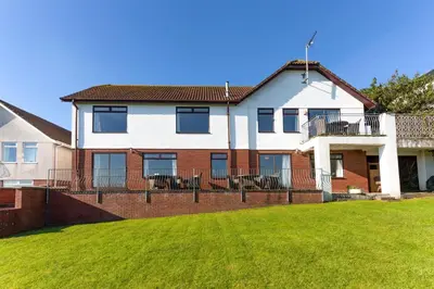 a house with a lawn in front of it at Beau Vista FF in Padstow