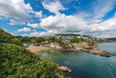 a view of a beach with houses on a hill at Quayside in Fowey