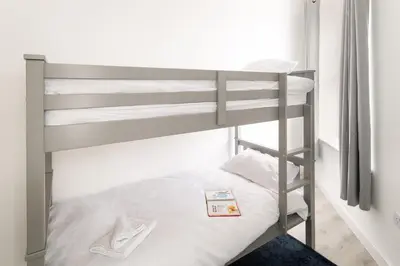 a bedroom with two bunk beds in a room at Trehawke House in Liskeard