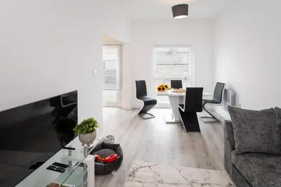 a living room with a couch and a table at Trehawke House in Liskeard