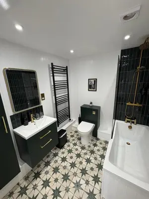 a bathroom with a sink and a toilet and a tub at Bagnalls Cottage, A newly renovated cottage in the heart of the Downalong, St Ives moments from the harbour beach in St Ives