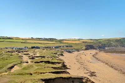 a view of a beach with people on the sand at Finest Retreats - Tregarden in Bude