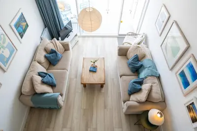 an overhead view of a living room with couches and a table at 17 Barnaloft in St Ives