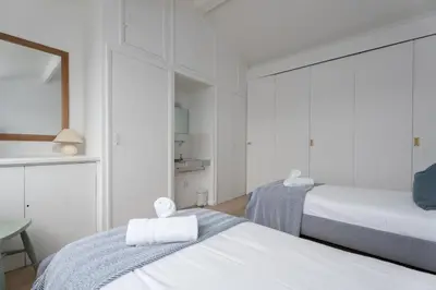 a bedroom with two beds with towels on them at 17 Barnaloft in St Ives