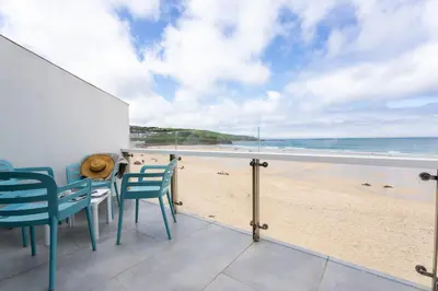 a view of the beach from the balcony of a beach house at 17 Barnaloft in St Ives