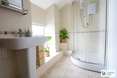 a bathroom with a sink and a shower at The Bird's Nest - Free Parking! in Boscastle