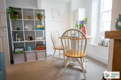 a dining room with two chairs and a table at The Bird's Nest - Free Parking! in Boscastle
