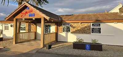 a building with a sign that says the sushi inn at 5Berth -Family Friendly -ParkingSpot -Heated Pool in St Austell