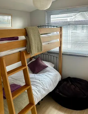 a bedroom with a bunk bed with a ladder at 204 Atlantic Bays, St Merryn in St Merryn