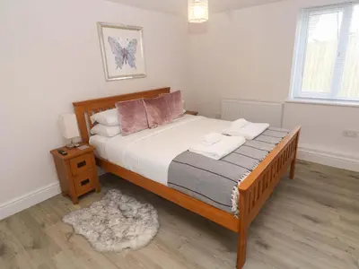 a bedroom with a bed with two towels on it at St Marys in Penzance