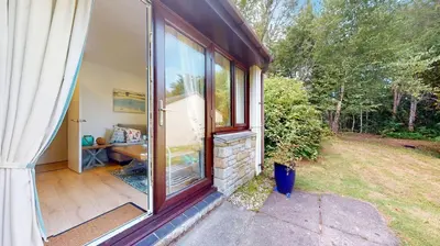 a house with a sliding glass door with a patio at St Ives Kornel Hewel 2 Bedrooms in St Ives
