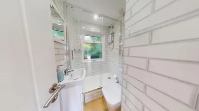 a white bathroom with a sink and a toilet at St Ives Kornel Hewel 2 Bedrooms in St Ives