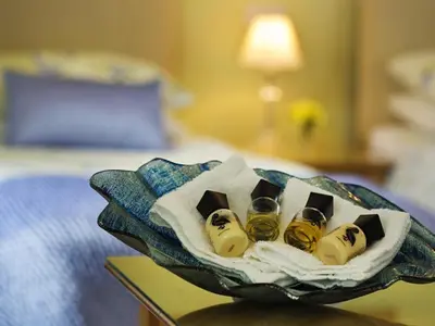 a basket of wine bottles on a table in a hotel room at Copper Meadow in Launceston